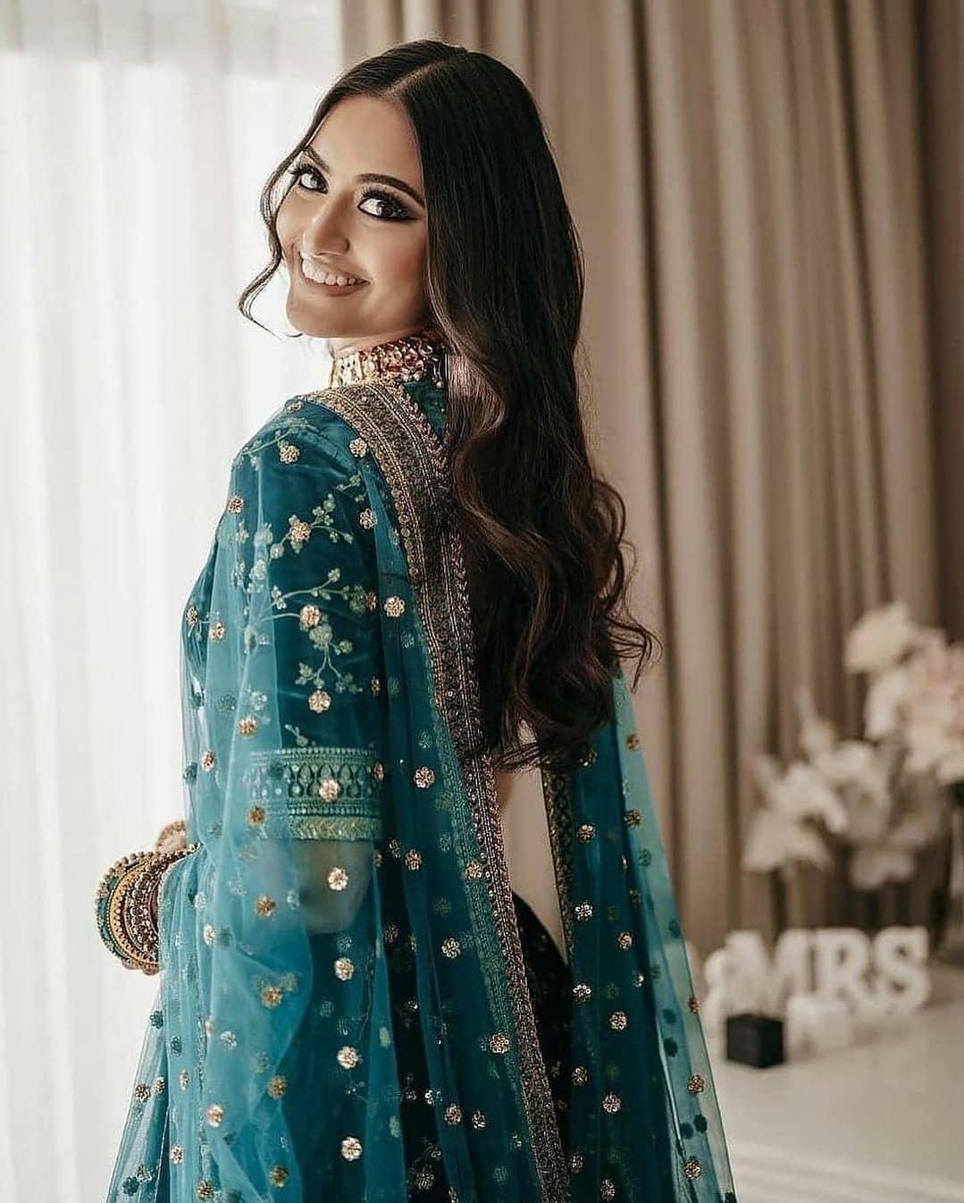 Green Heavy Bridal Wear Lehenga Choli - Rent main image 0